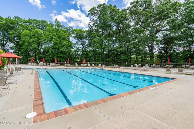 a view of swimming pool with chairs