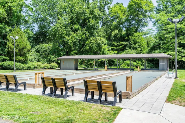 a view of a chairs and table in the balcony