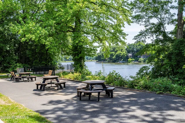 a view of a backyard with sitting area