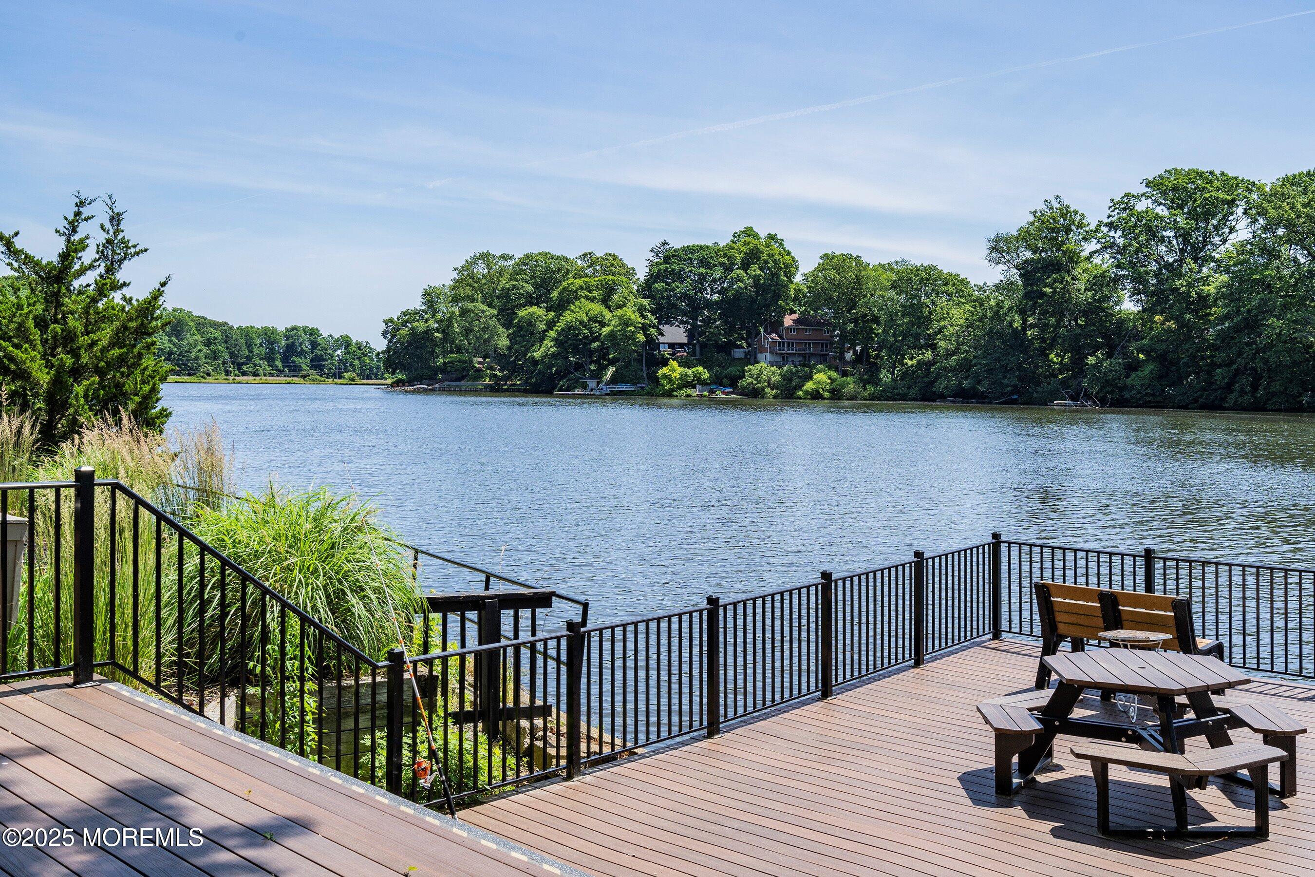 32 Ellsworth Court Red Bank, NJ 07701 - Photo 31 of 32 a view of a balcony with wooden floor and lake view