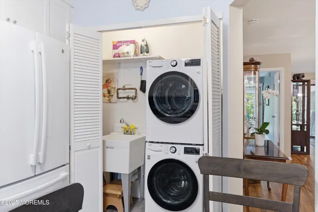 a view of a hallway with washer and dryer