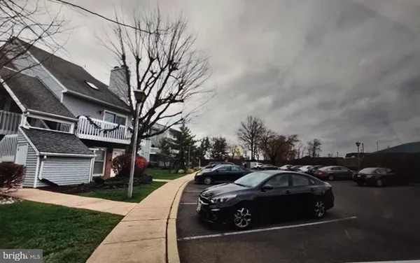 a view of a car parked in front of a house