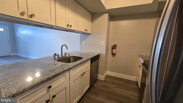 a kitchen with a sink and cabinets