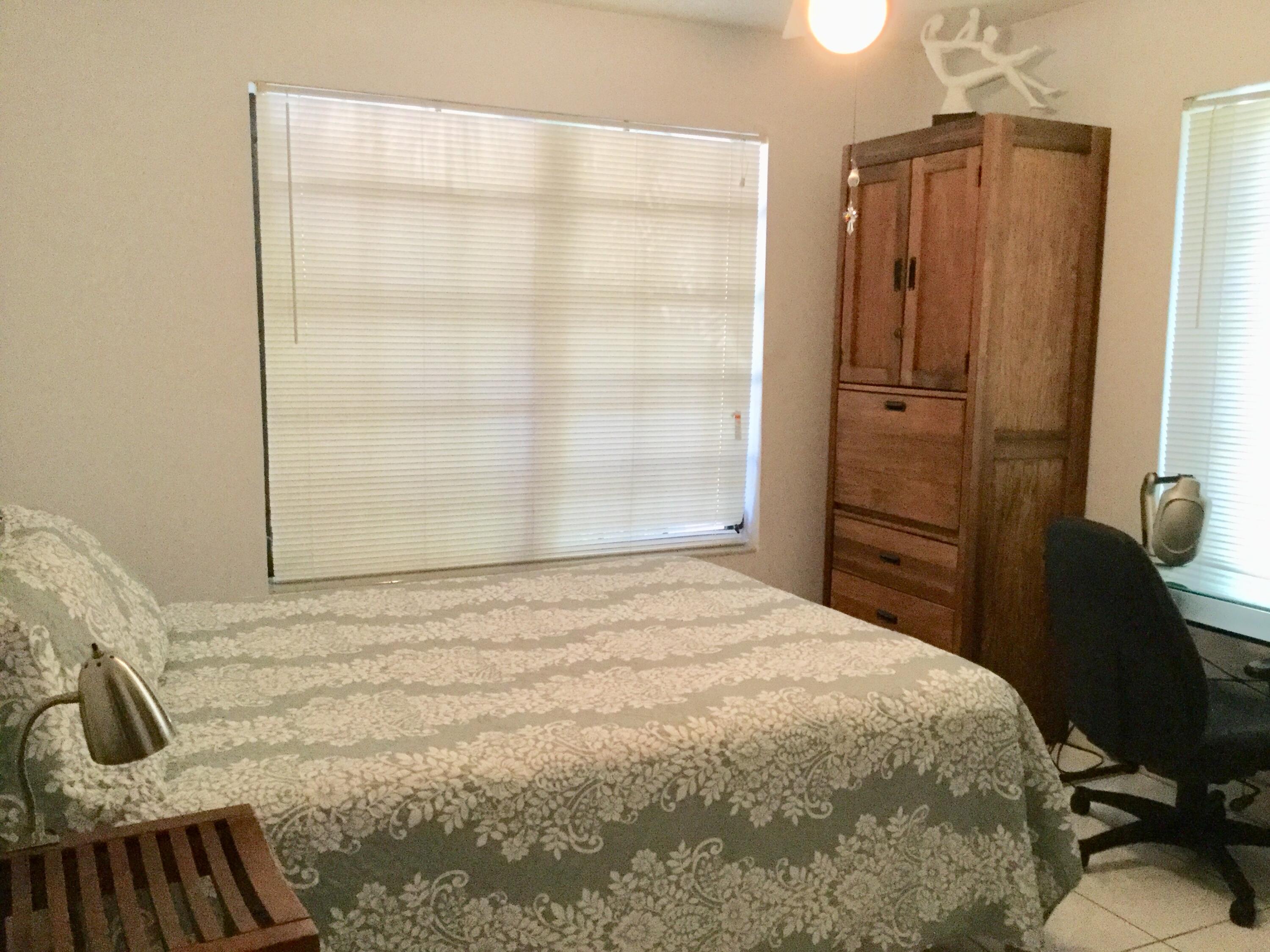 1610 Laird Street Key West, FL 33040 - Photo 11 of 20 a bedroom with a bed and a dresser
