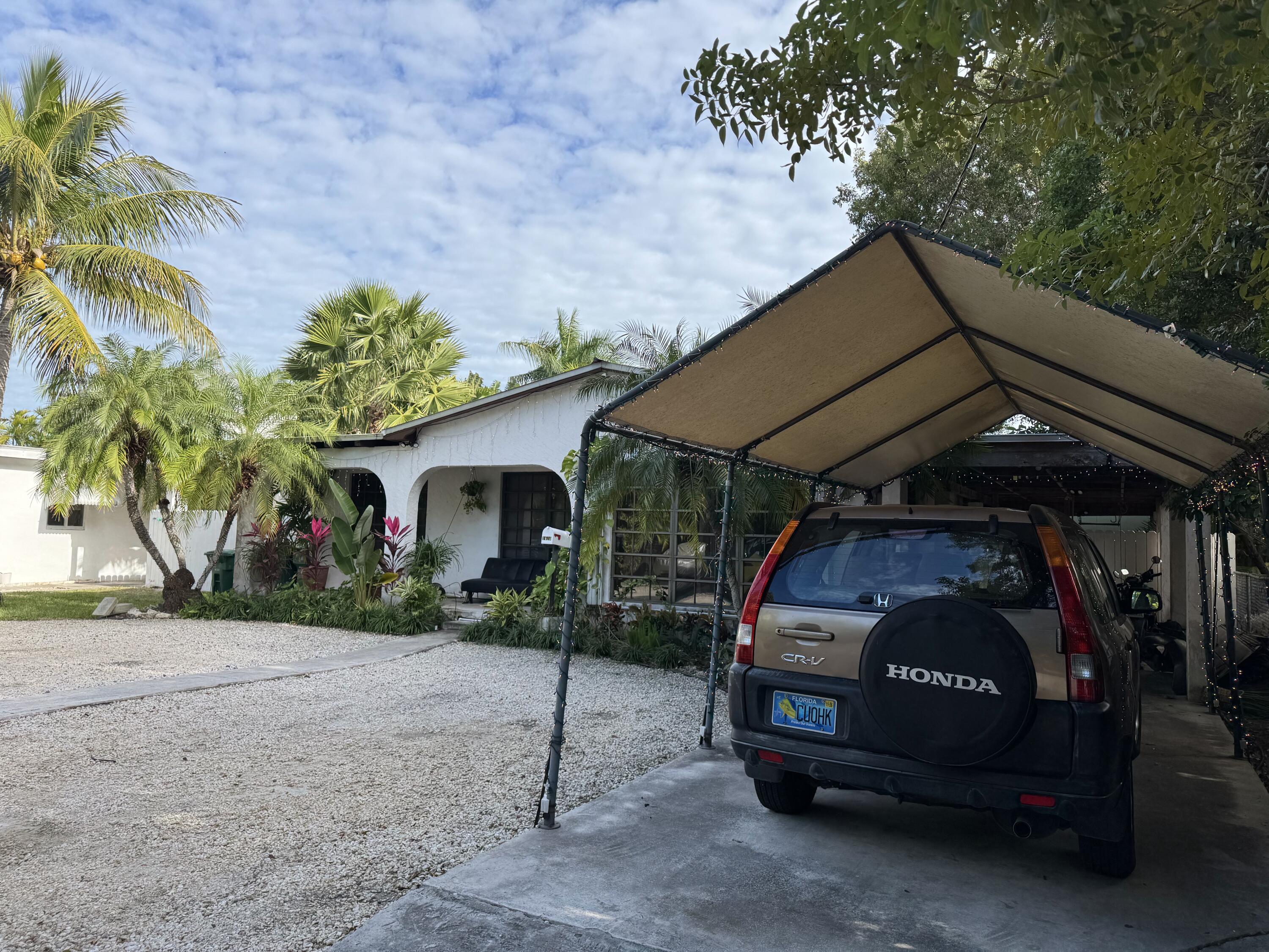1610 Laird Street Key West, FL 33040 - Photo 12 of 20 a view of car parked in front of house