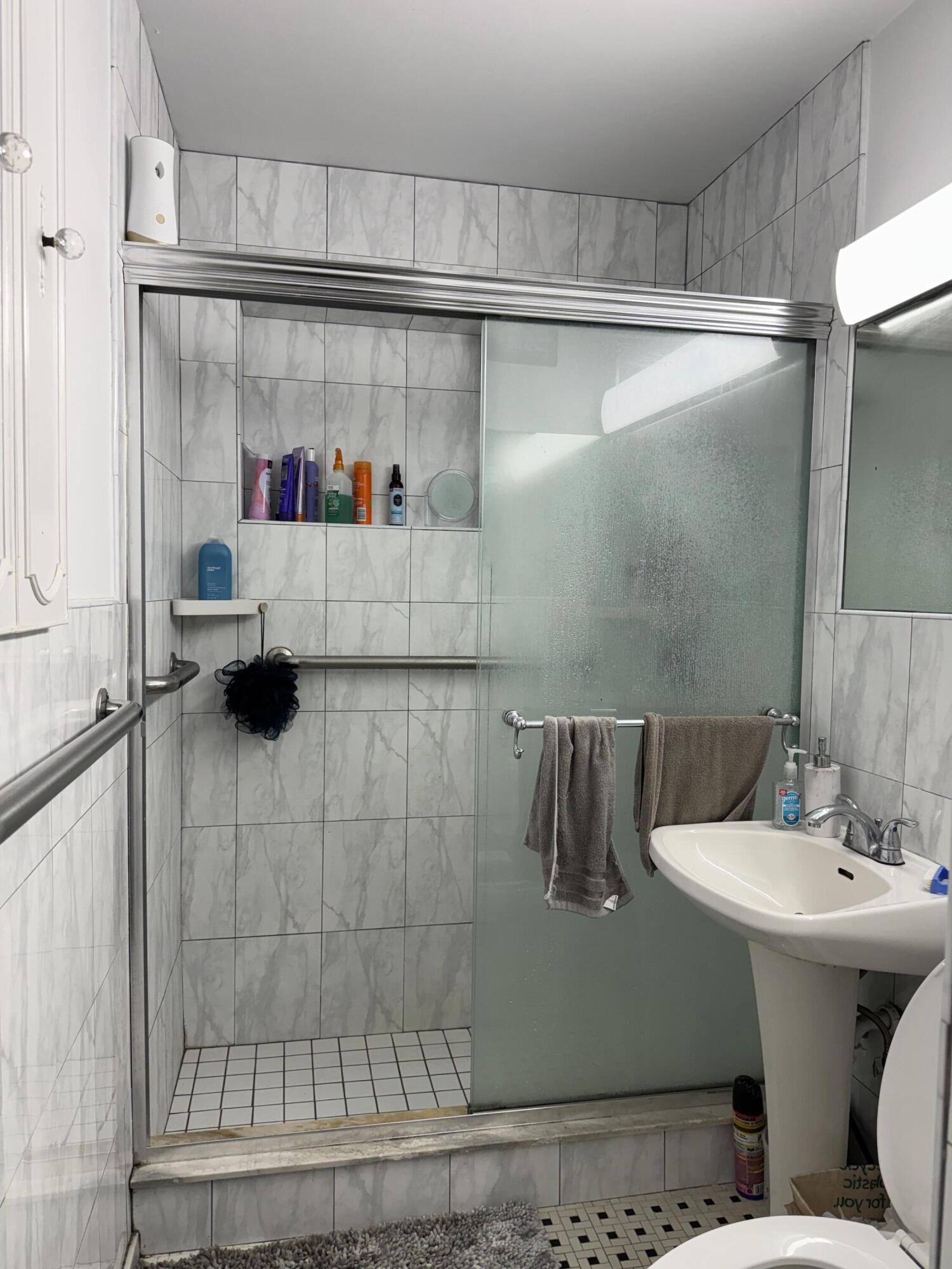 1610 Laird Street Key West, FL 33040 - Photo 14 of 20 a bathroom with a sink and a shower