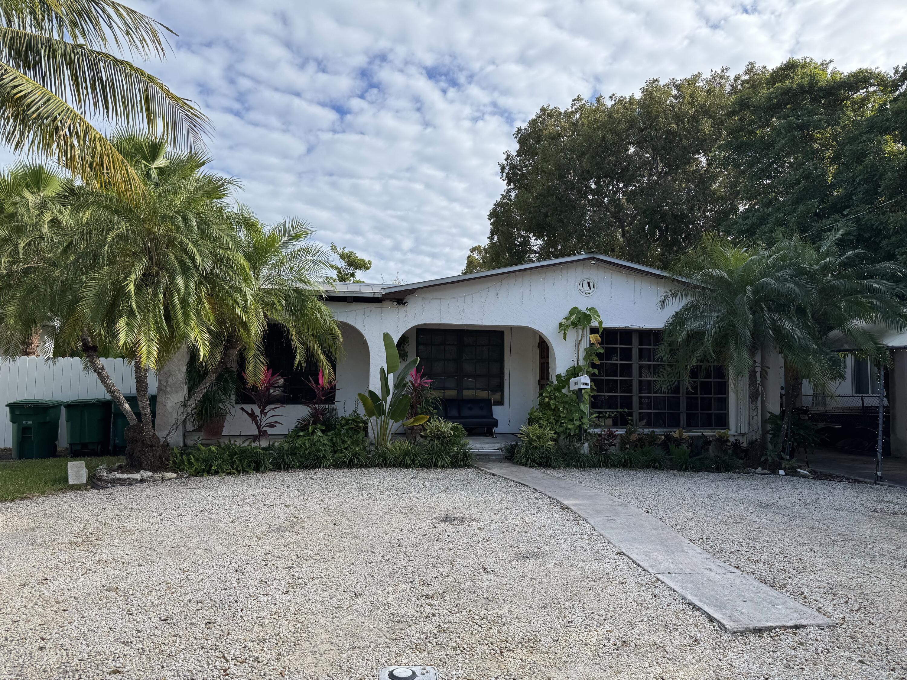 1610 Laird Street Key West, FL 33040 - Photo 16 of 22 a view of a house with a yard
