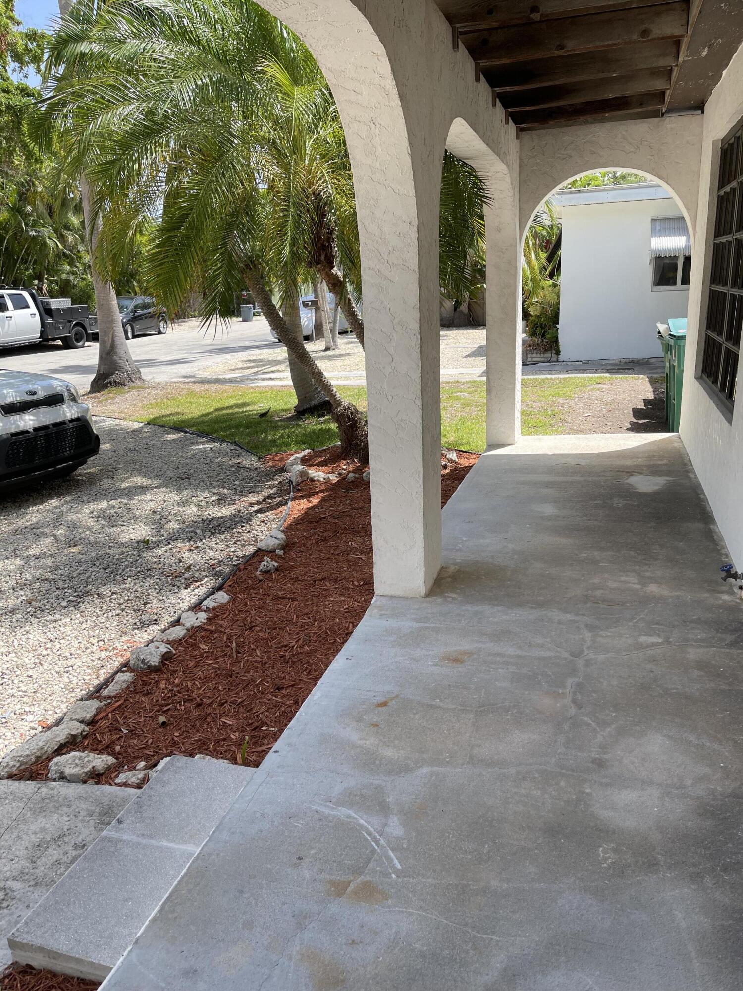 1610 Laird Street Key West, FL 33040 - Photo 17 of 20 a view of a couches with wooden fence