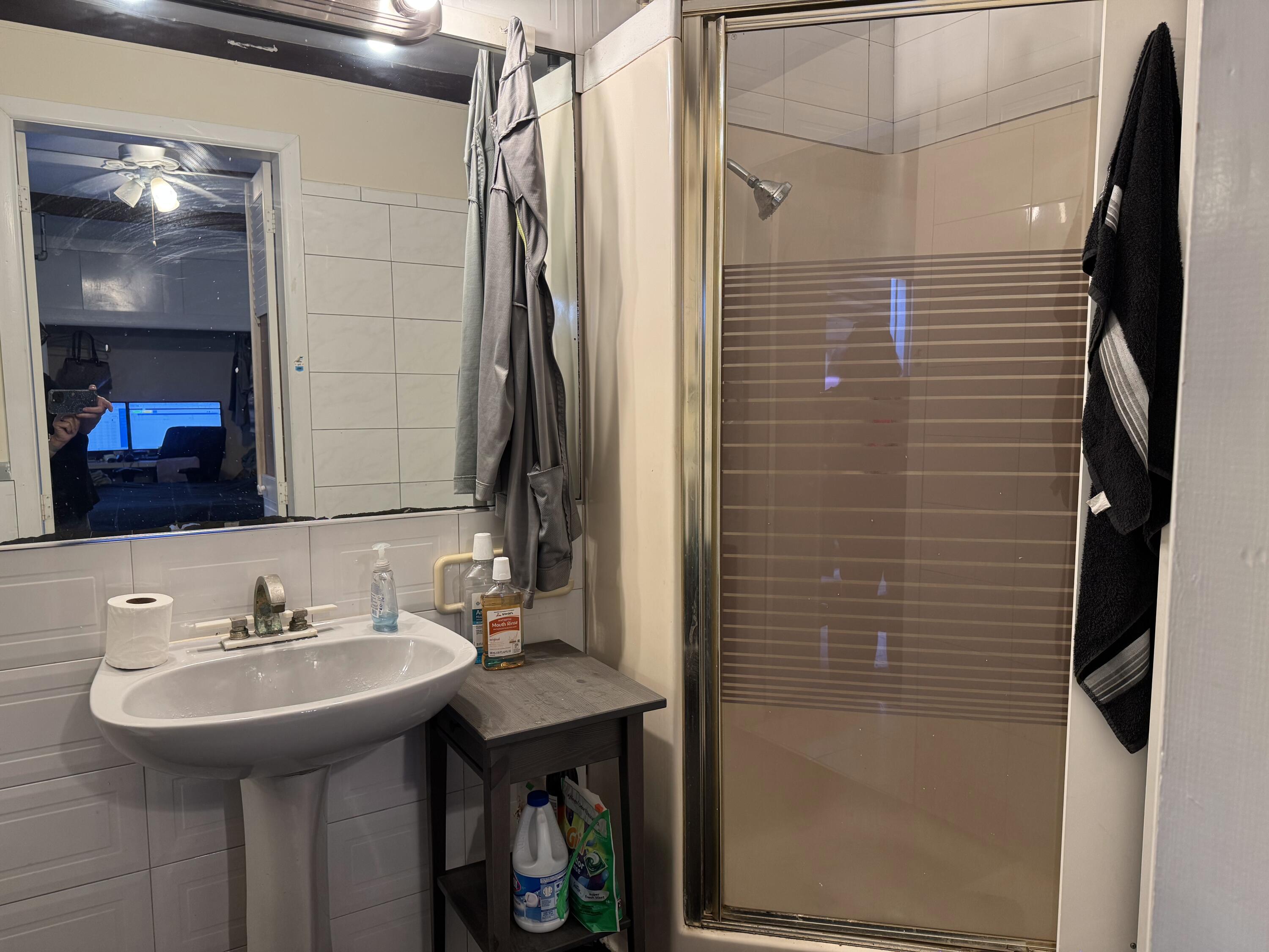 1610 Laird Street Key West, FL 33040 - Photo 20 of 22 a bathroom with a sink and a mirror