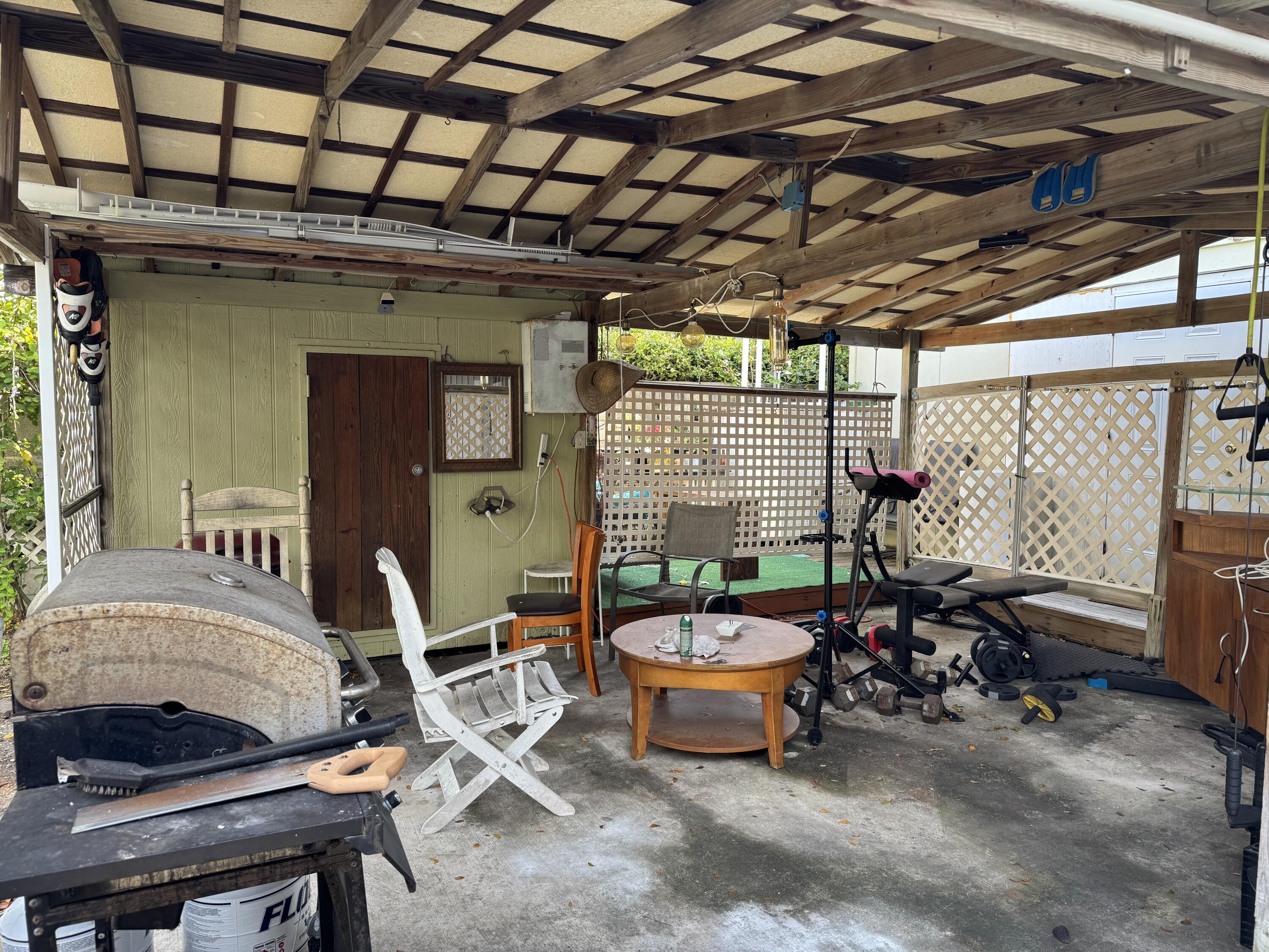 1610 Laird Street Key West, FL 33040 - Photo 20 of 20 a outdoor space with patio lots of furniture and iron stairs