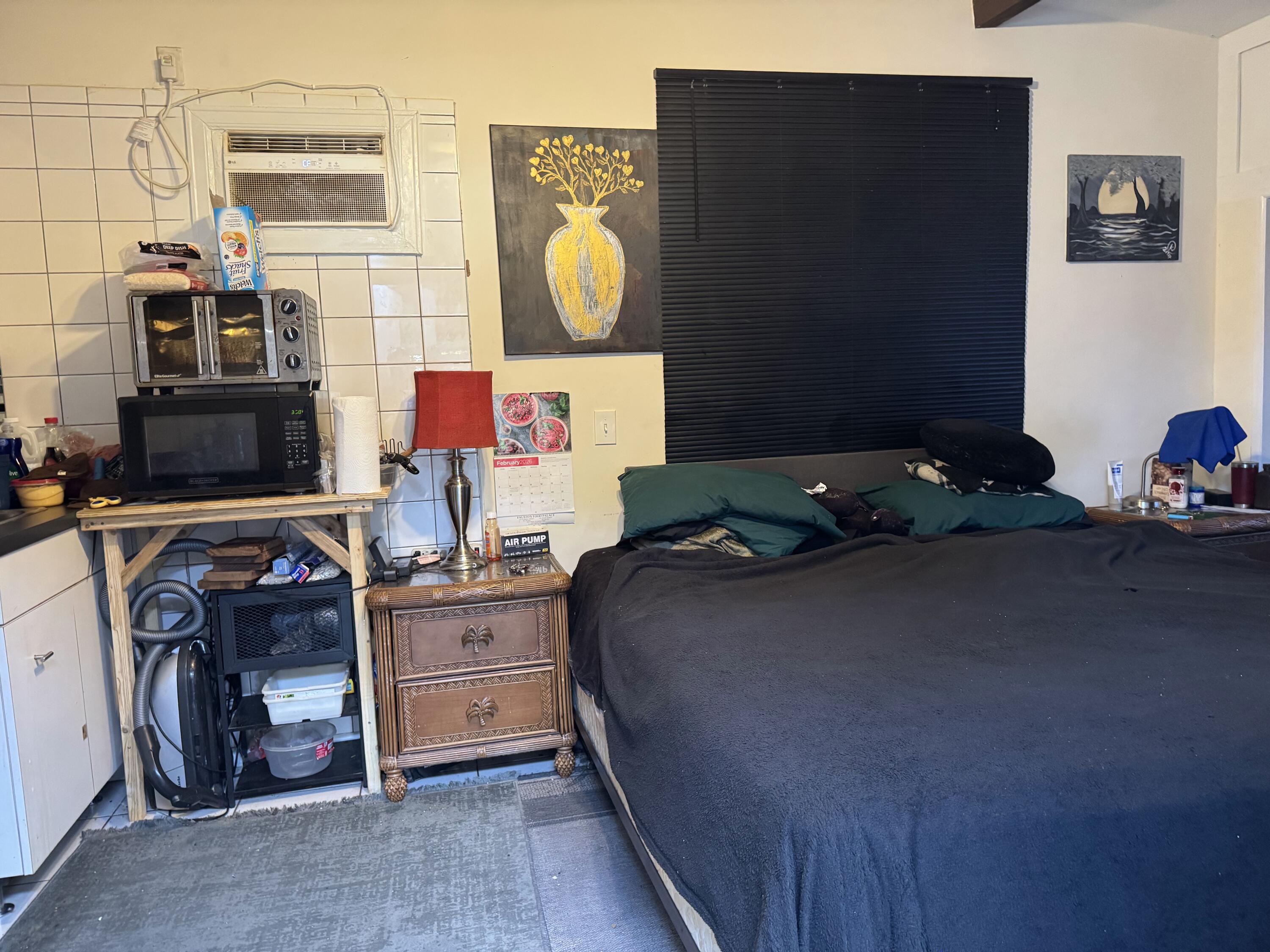 1610 Laird Street Key West, FL 33040 - Photo 2 of 22 a bedroom with a bed and cabinets