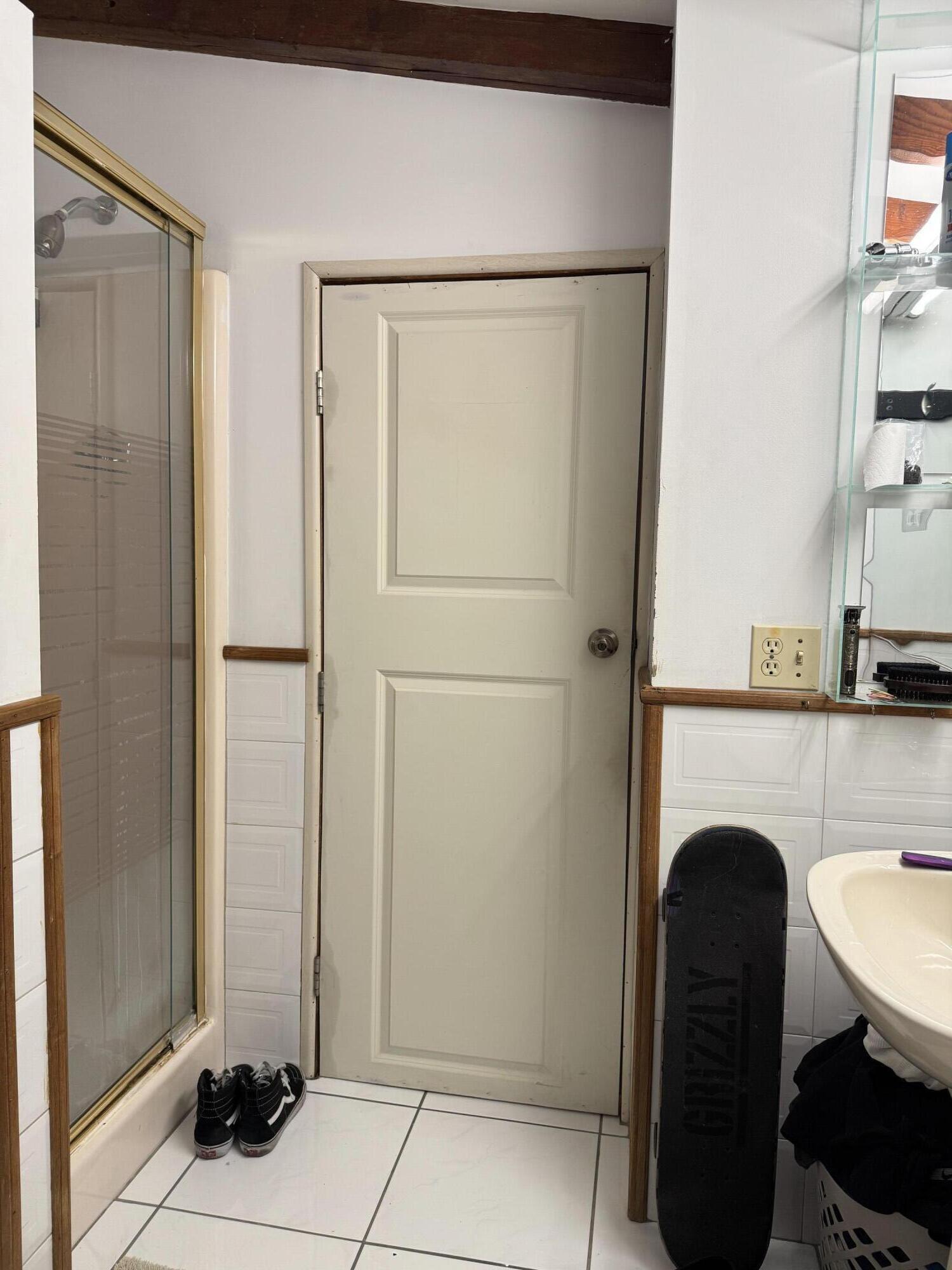 1610 Laird Street Key West, FL 33040 - Photo 4 of 22 a kitchen with a white refrigerator freezer a washer and dryer