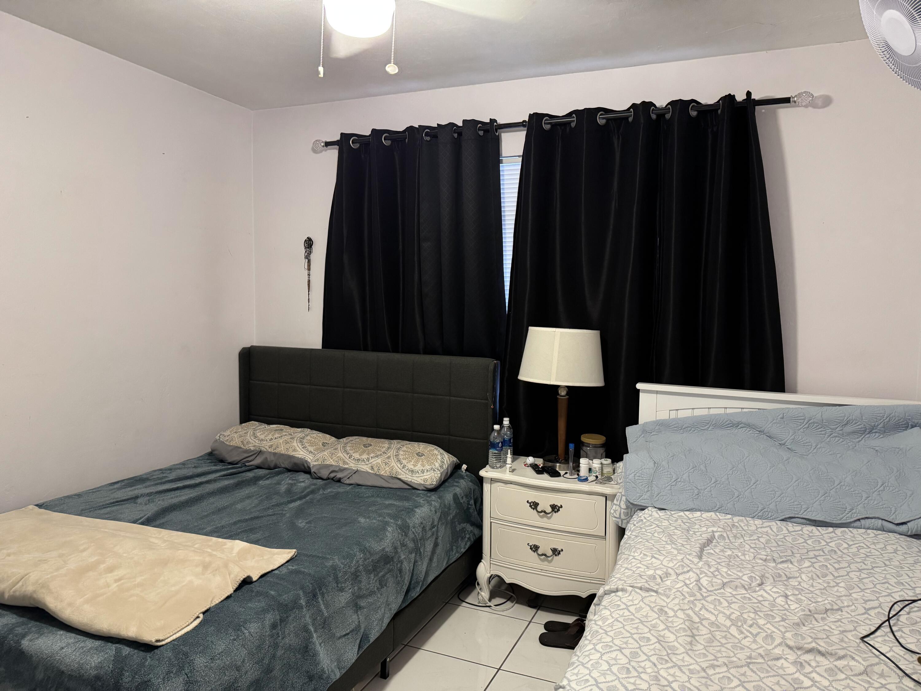 1610 Laird Street Key West, FL 33040 - Photo 7 of 22 a bedroom with a bed and a window