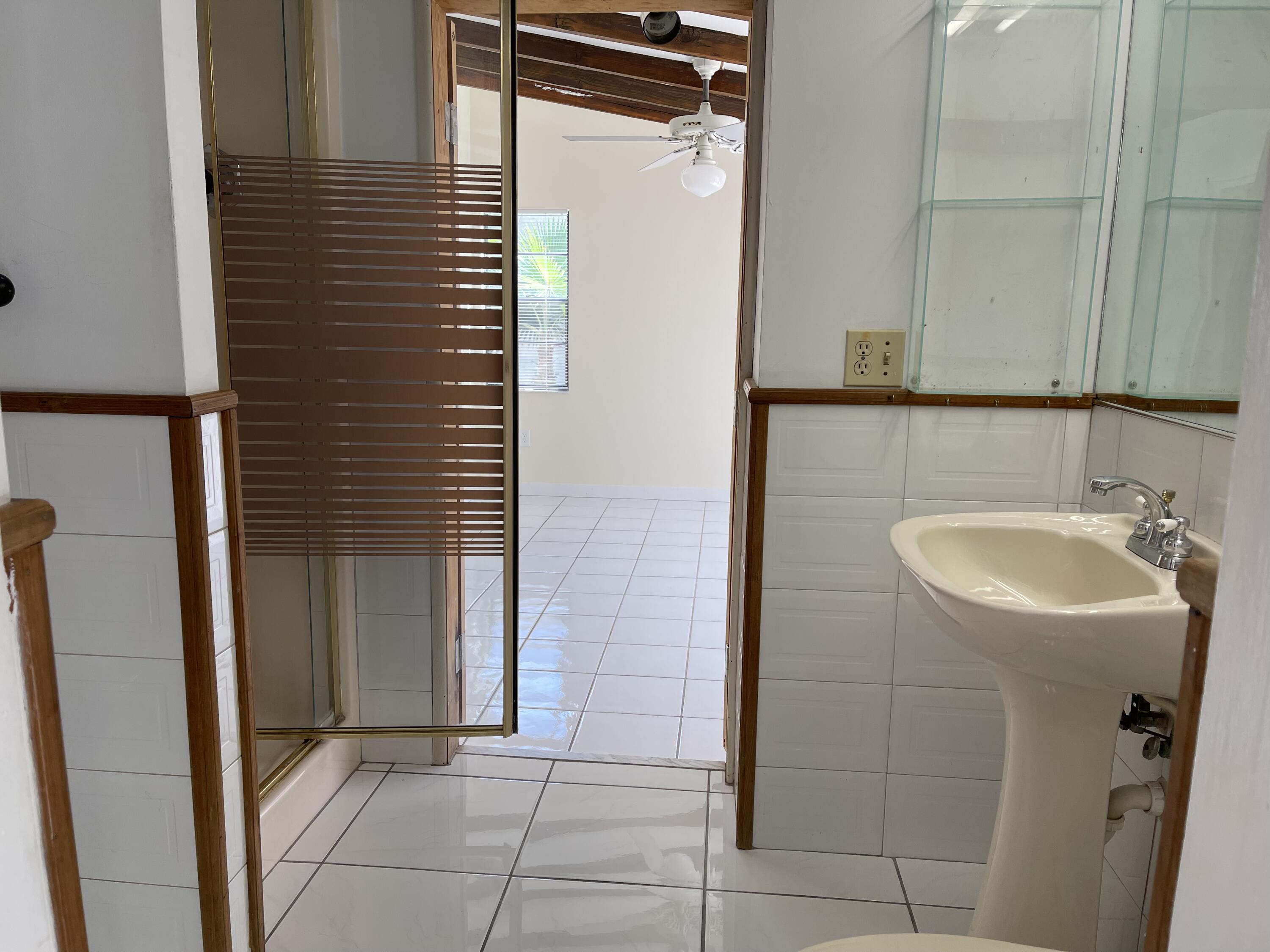 1610 Laird Street Key West, FL 33040 - Photo 7 of 20 a bathroom with a sink and shower