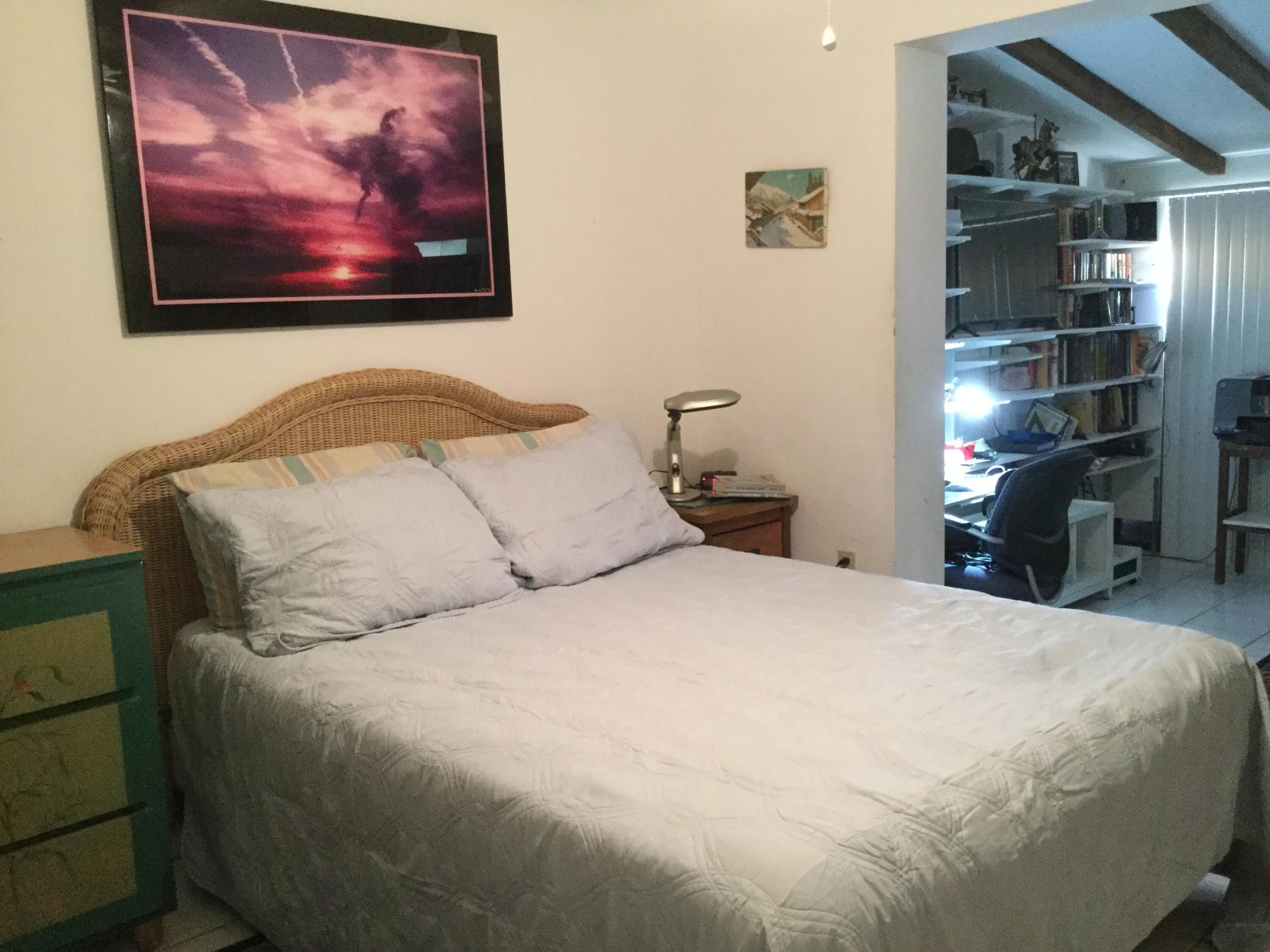 1610 Laird Street Key West, FL 33040 - Photo 8 of 20 a bedroom with a bed and wall painting