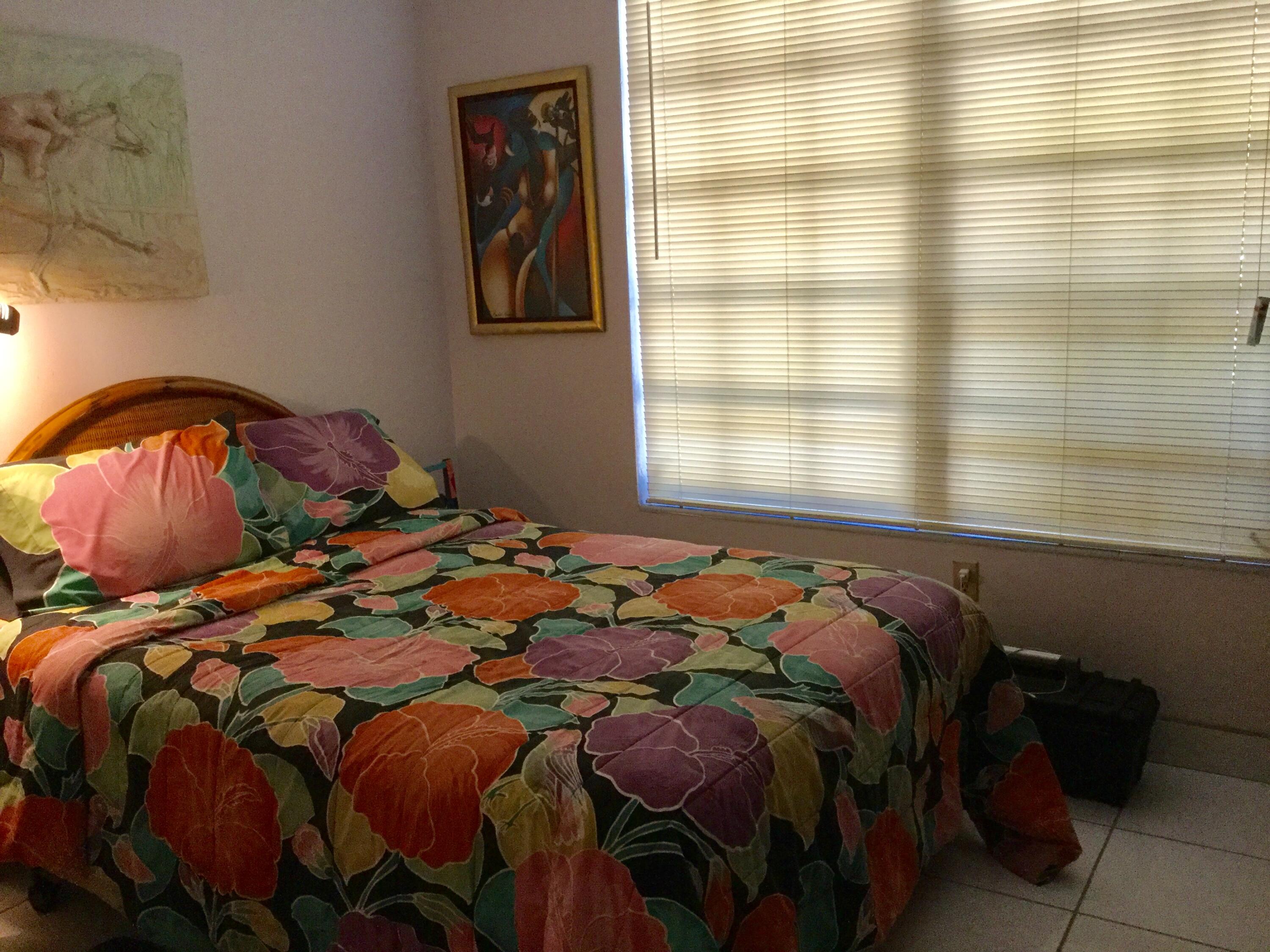 1610 Laird Street Key West, FL 33040 - Photo 10 of 20 a bed sitting in a bedroom next to a window