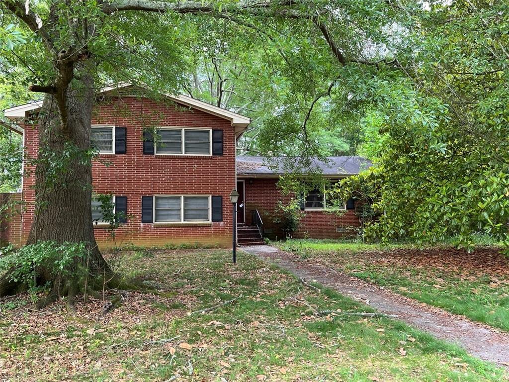 a backyard of a house with lots of green space