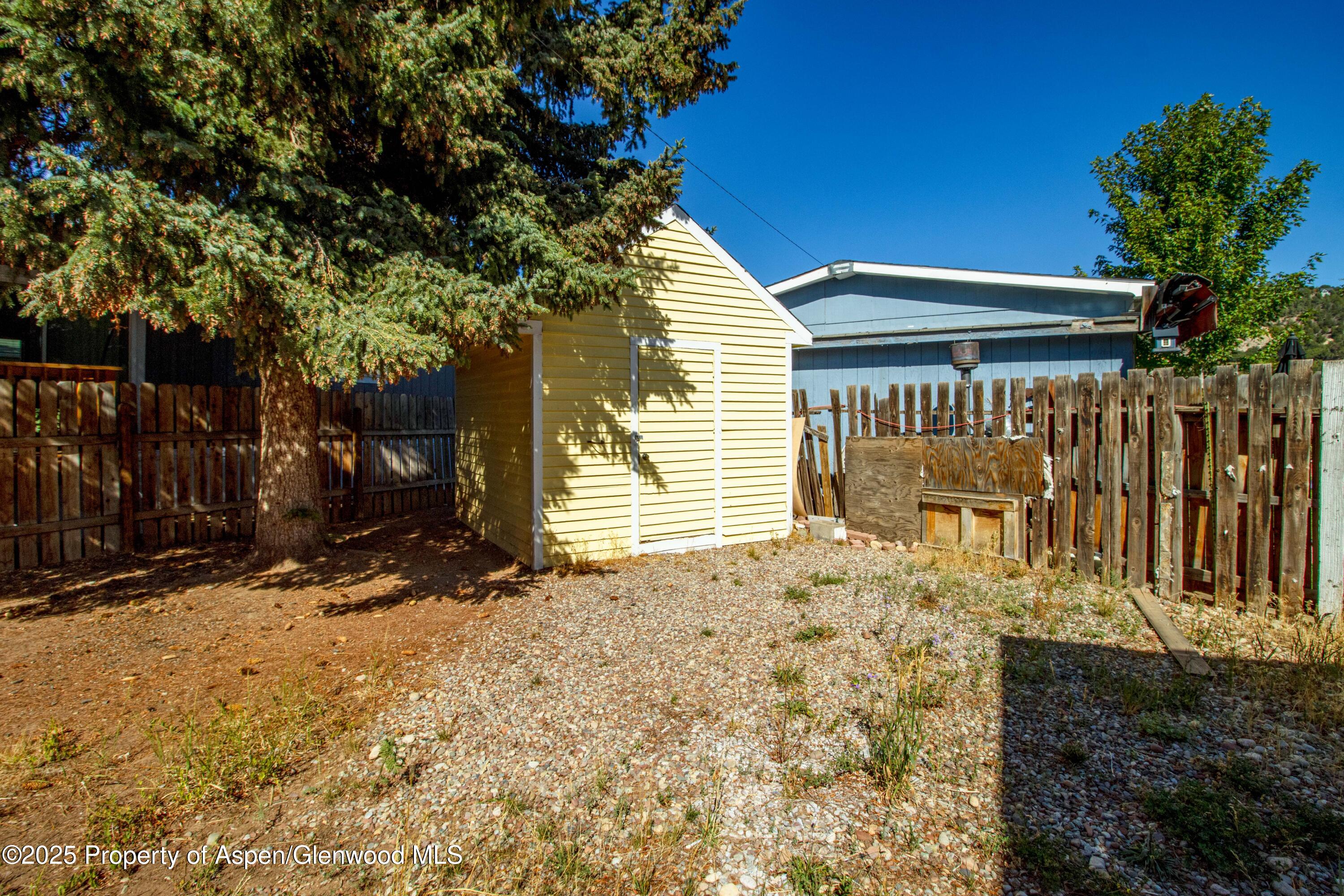161 James Circle El Jebel, CO 81623 - Photo 22 of 24 a view of a house with a tree in the yard