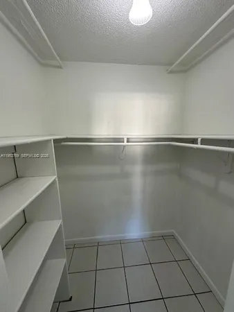 a view of an empty walk in closet