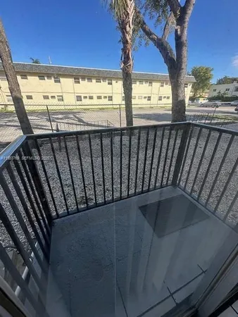 a view of a balcony with an outdoor space