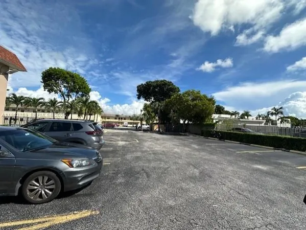 a view of a car parked in front of a house