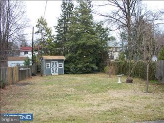 35 Princeton Road Audubon, NJ 08106 - Photo 4 of 6 a backyard of a house with lots of green space