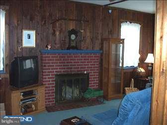 35 Princeton Road Audubon, NJ 08106 - Photo 5 of 6 a living room with furniture and a fireplace