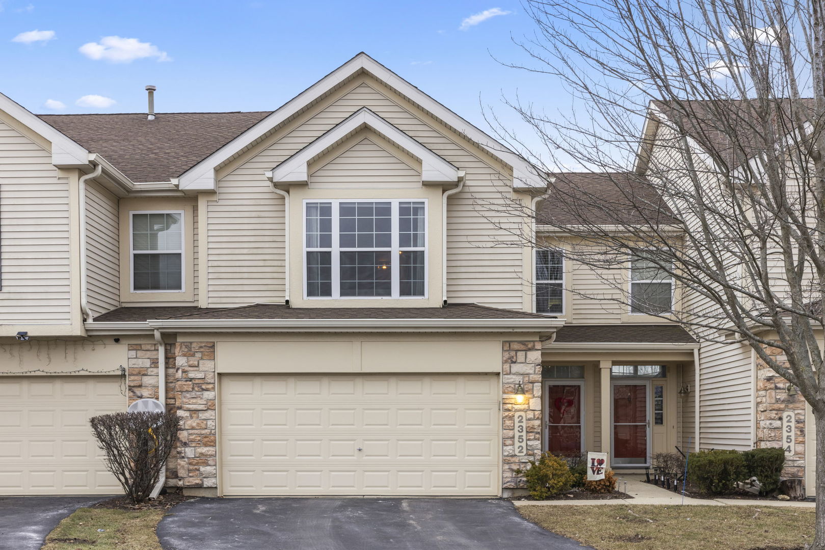 a front view of a house with garage