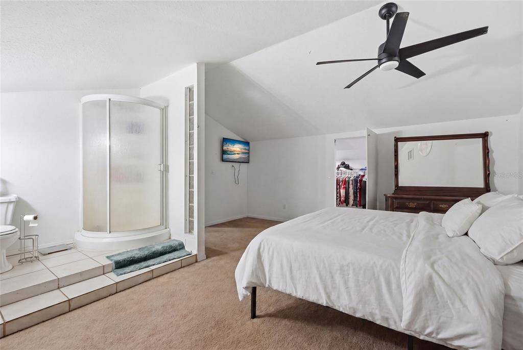 401 Southeast Falcon Road Branford, FL 32008 - Photo 38 of 76 a bedroom with a bed and a mirror