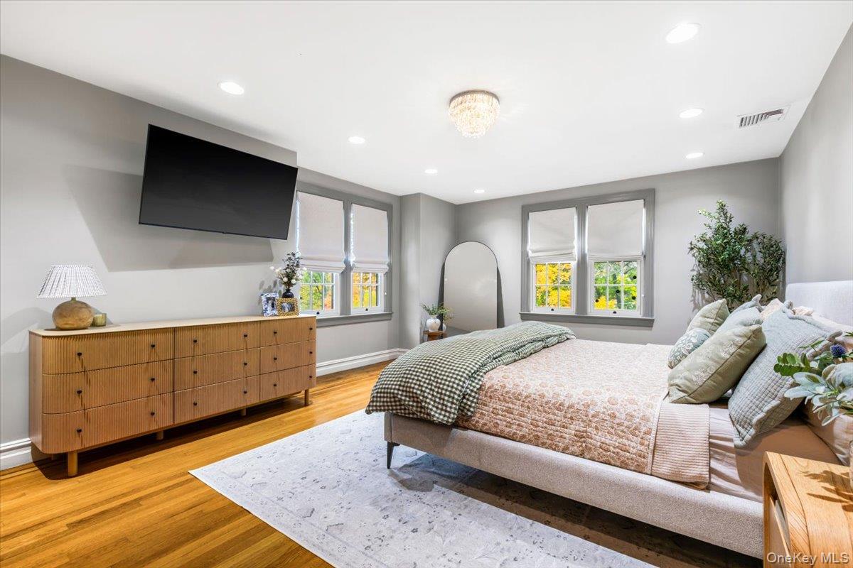 620 Timpson Street Pelham, NY 10803 - Photo 14 of 32 a bedroom with a large bed and a window