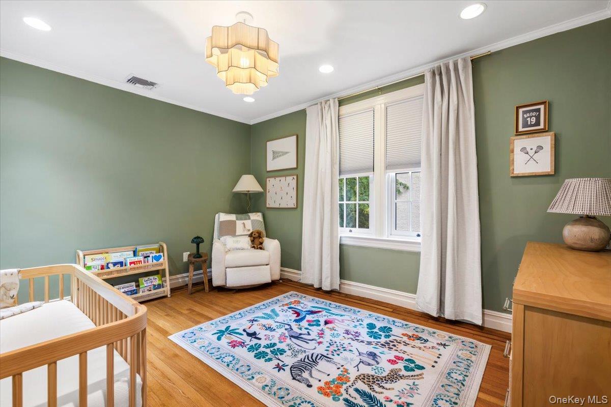 620 Timpson Street Pelham, NY 10803 - Photo 17 of 32 a bedroom with furniture and a window