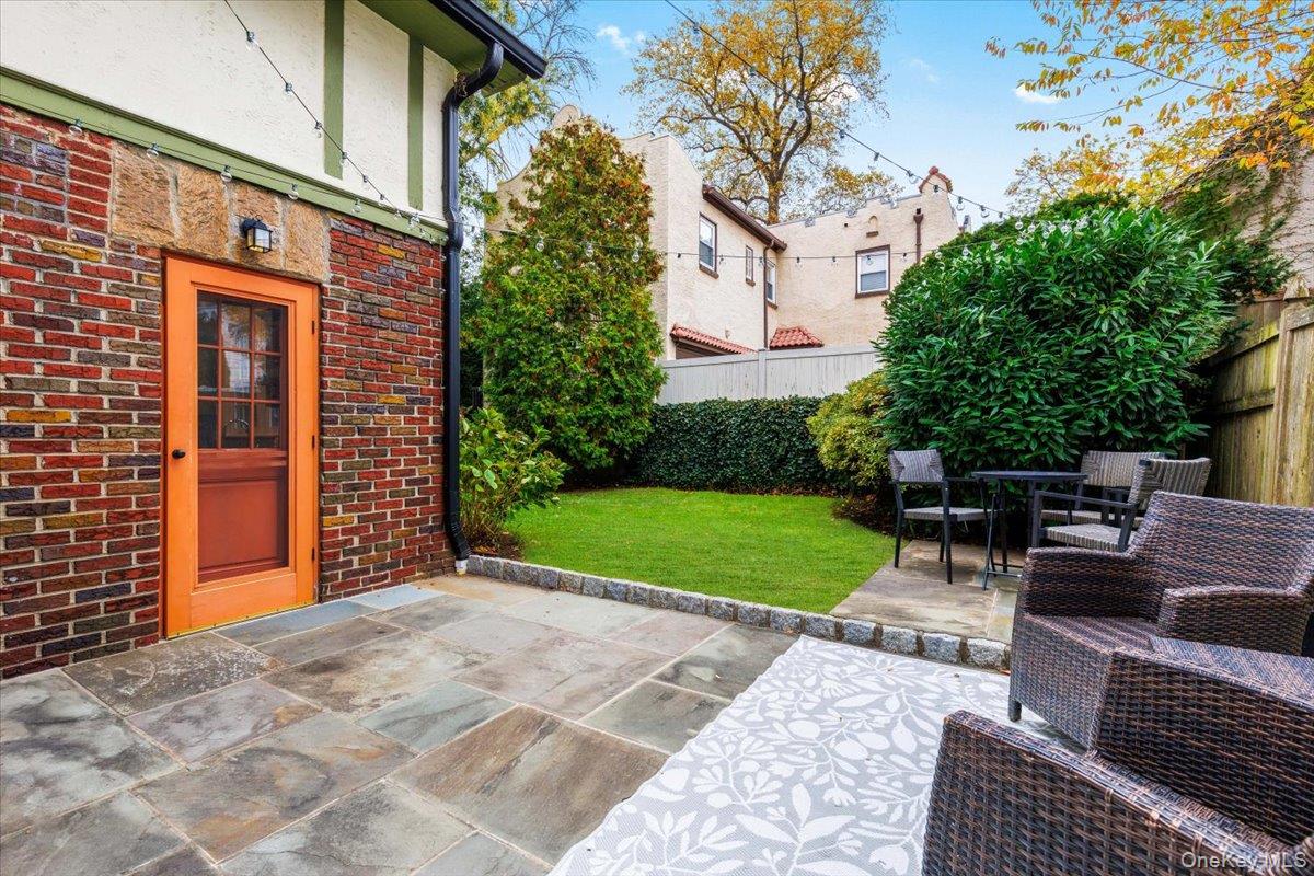 620 Timpson Street Pelham, NY 10803 - Photo 25 of 32 a view of backyard with outdoor seating and green space