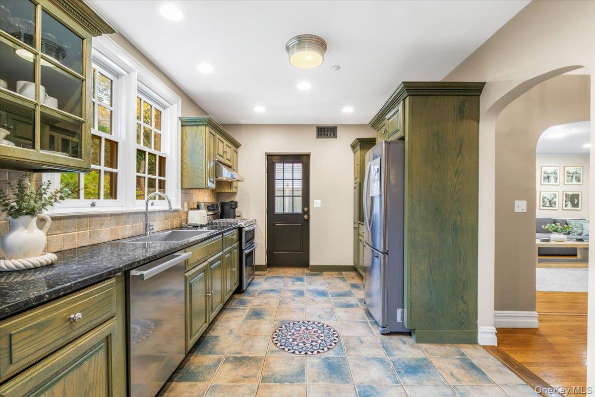 620 Timpson Street Pelham, NY 10803 - Photo 6 of 32 a large kitchen with stainless steel appliances granite countertop a refrigerator and a sink