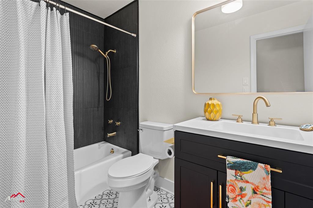 5524 Hickory Ridge Drive Bossier City, LA 71111 - Photo 7 of 17 a bathroom with a sink a toilet and shower