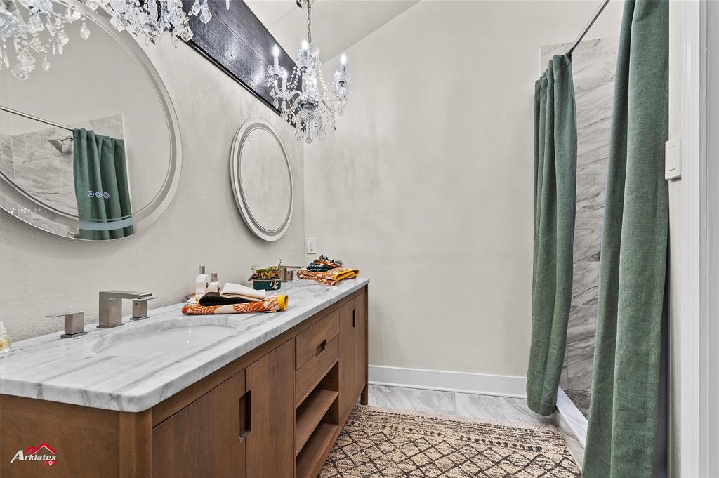 5524 Hickory Ridge Drive Bossier City, LA 71111 - Photo 9 of 17 a bathroom with a sink a mirror and shower view
