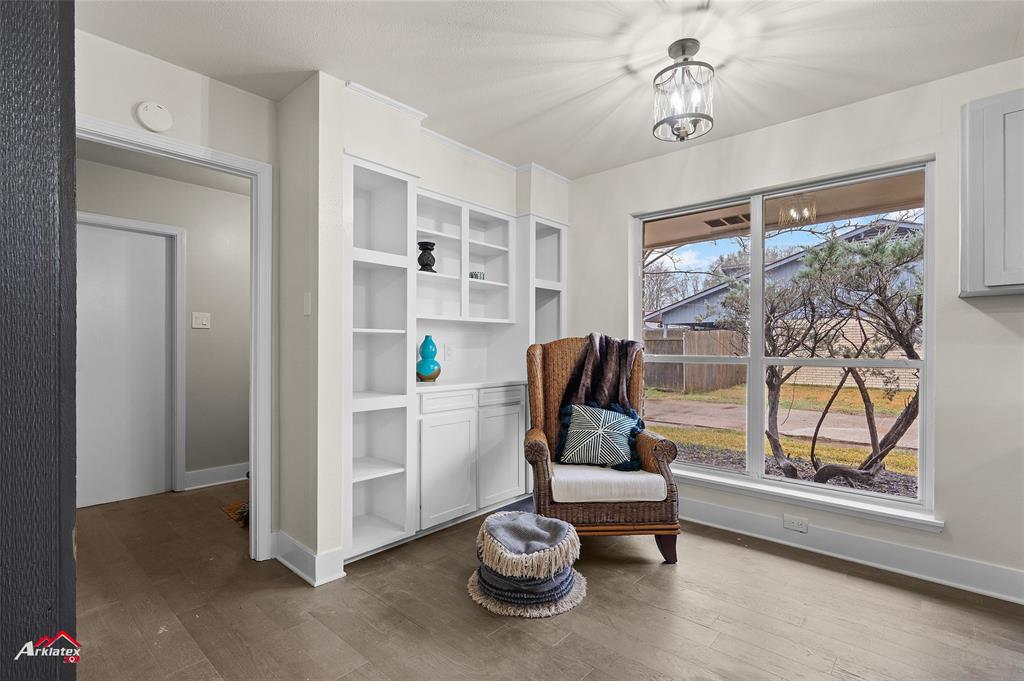 5524 Hickory Ridge Drive Bossier City, LA 71111 - Photo 10 of 17 a living room with furniture a window and a chandelier