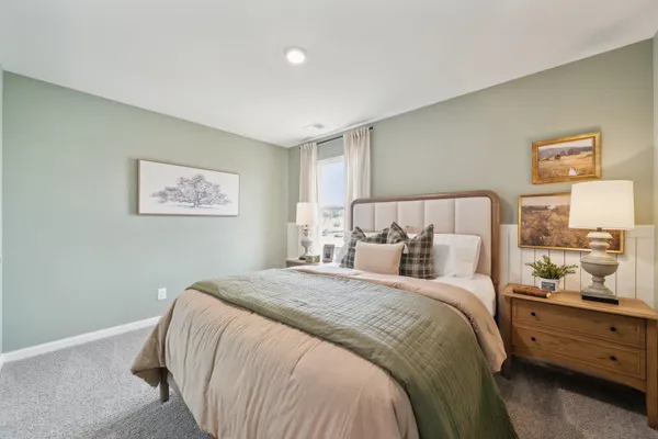 a bed room with a bed and a night stand
