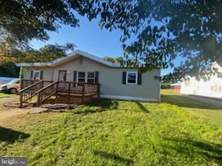 a view of a house with a big yard