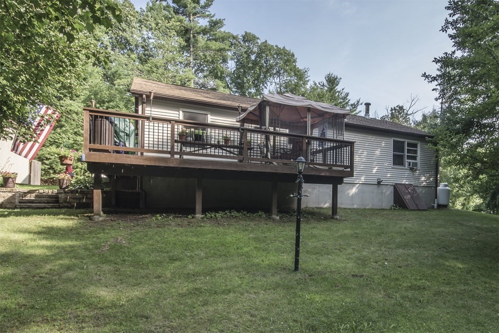 23 Sczygiel Road Ware, MA 01082 - Photo 9 of 41 a backyard of a house with table and chairs