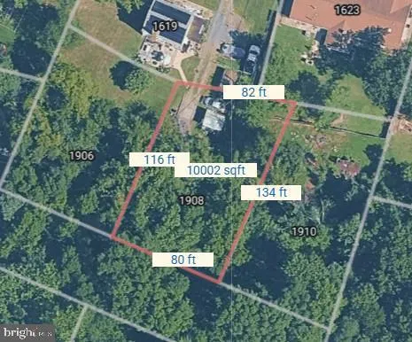 an aerial view of houses with yard