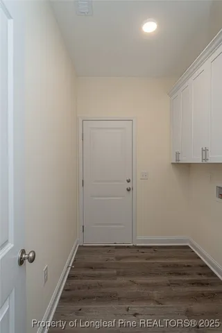a view of a room with wooden floor