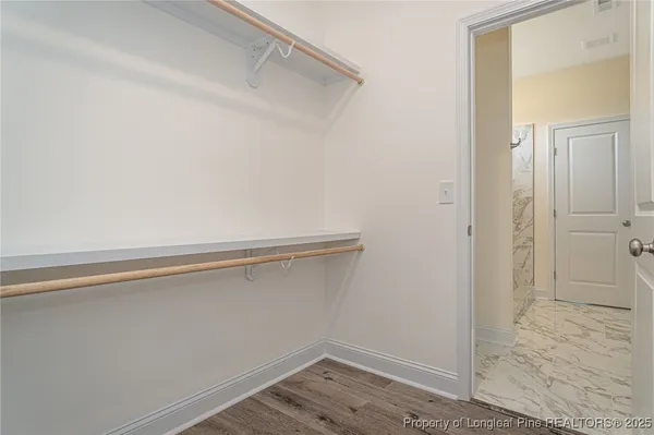 a view of an empty walk in closet