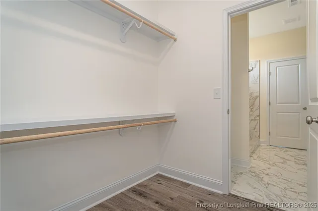 a view of an empty walk in closet