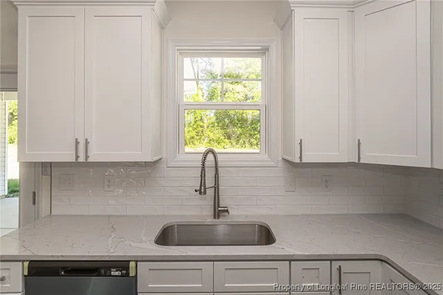 a kitchen with a sink and window