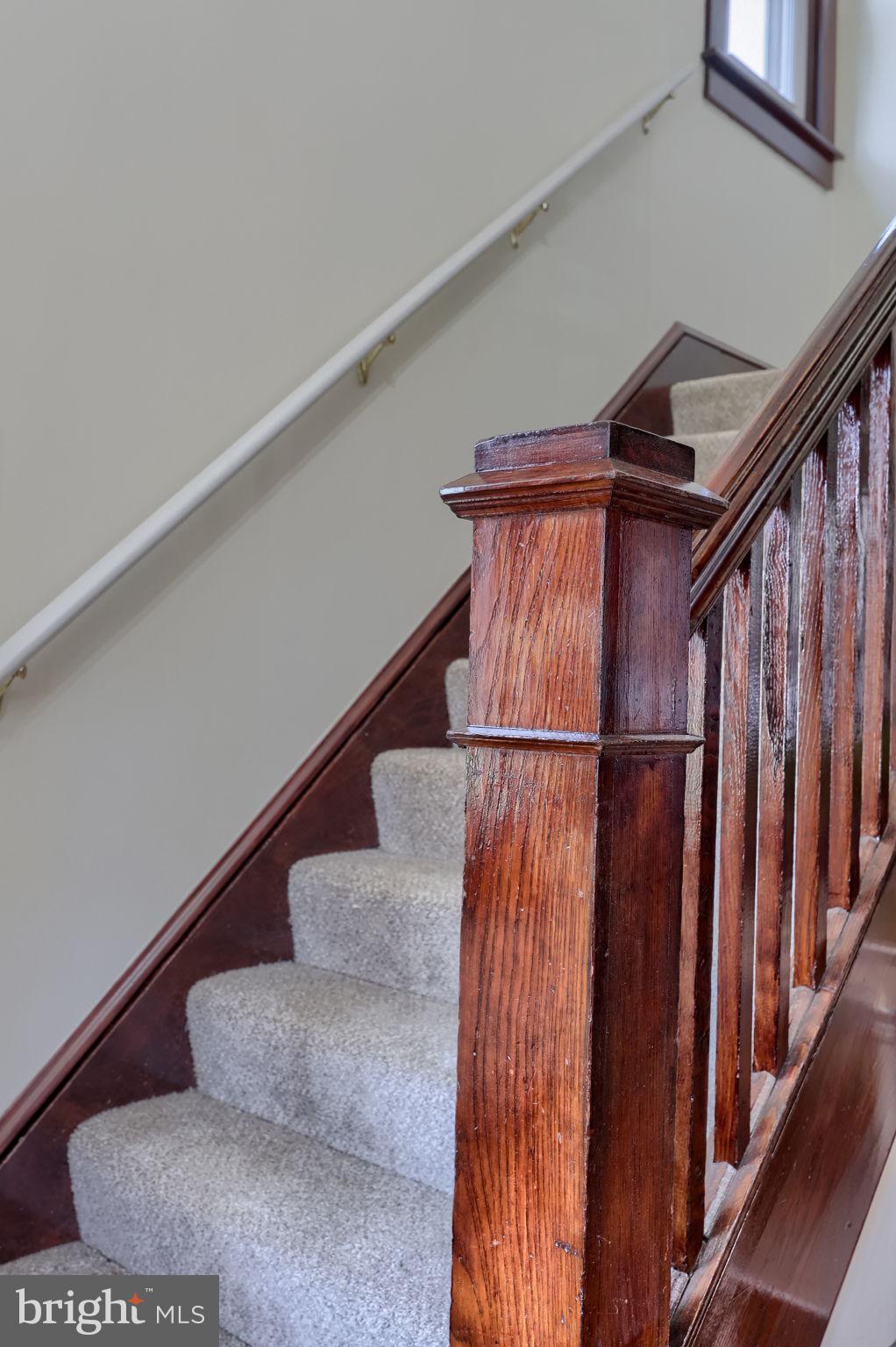 631 South Broad Street Lititz, PA 17543 - Photo 37 of 55 Elegant staircase with rich wood accents.