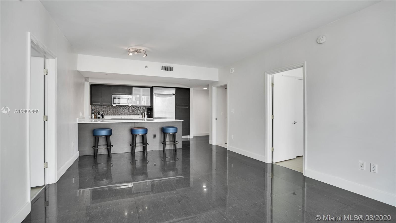 55 Southeast 6th Street, Unit 1903 Miami, FL 33131 - Photo 1 of 26 a view of a dining room with furniture