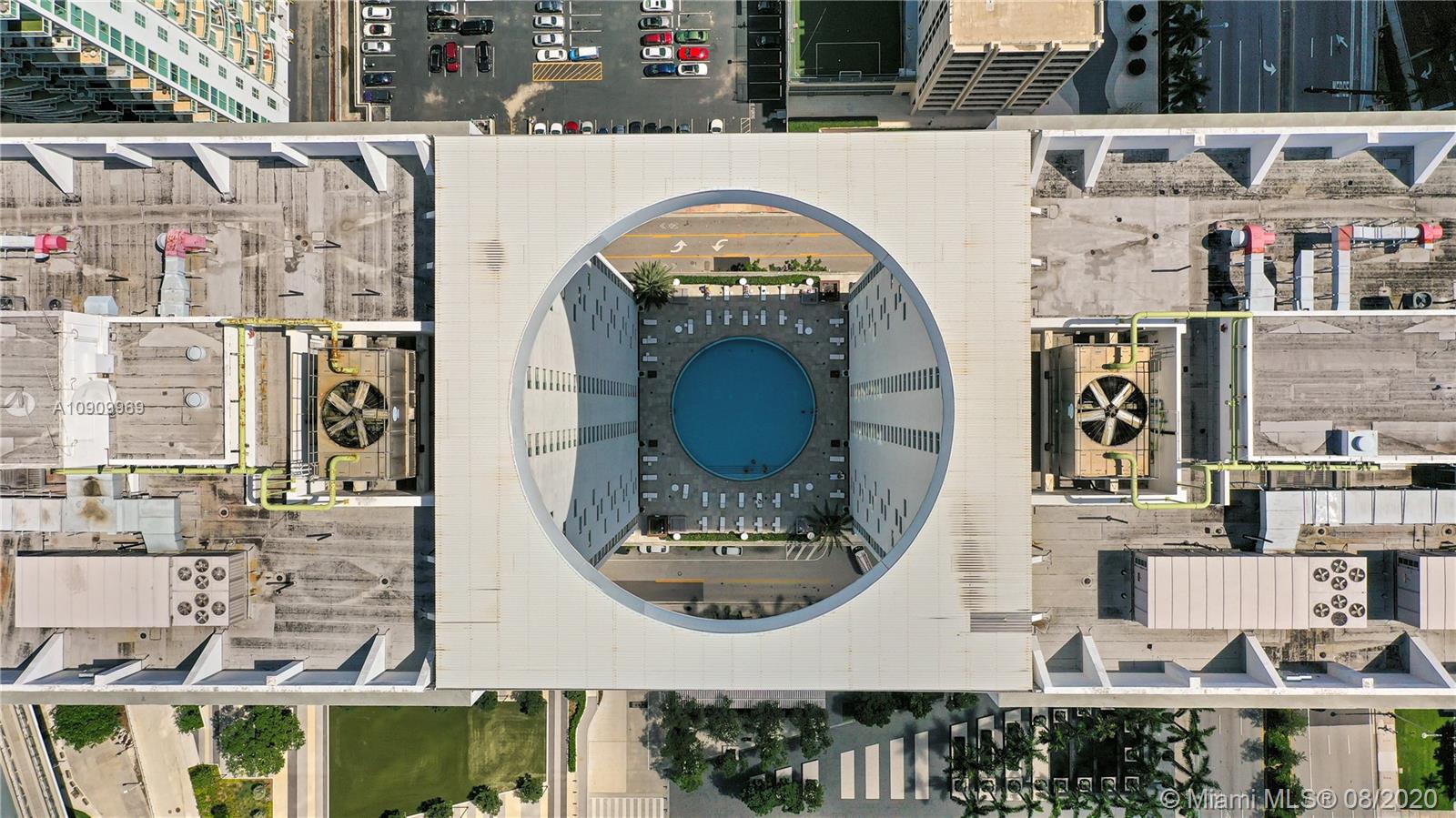 55 Southeast 6th Street, Unit 1903 Miami, FL 33131 - Photo 24 of 26 a picture of a table and chairs in the patio