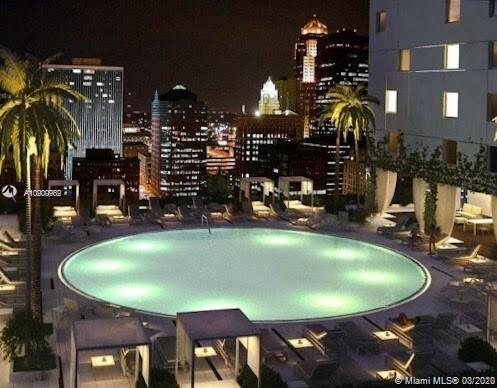 55 Southeast 6th Street, Unit 1903 Miami, FL 33131 - Photo 26 of 26 a view of a dining room with furniture