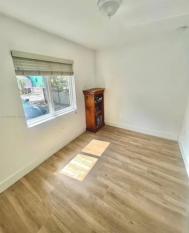 a view of an empty room and window
