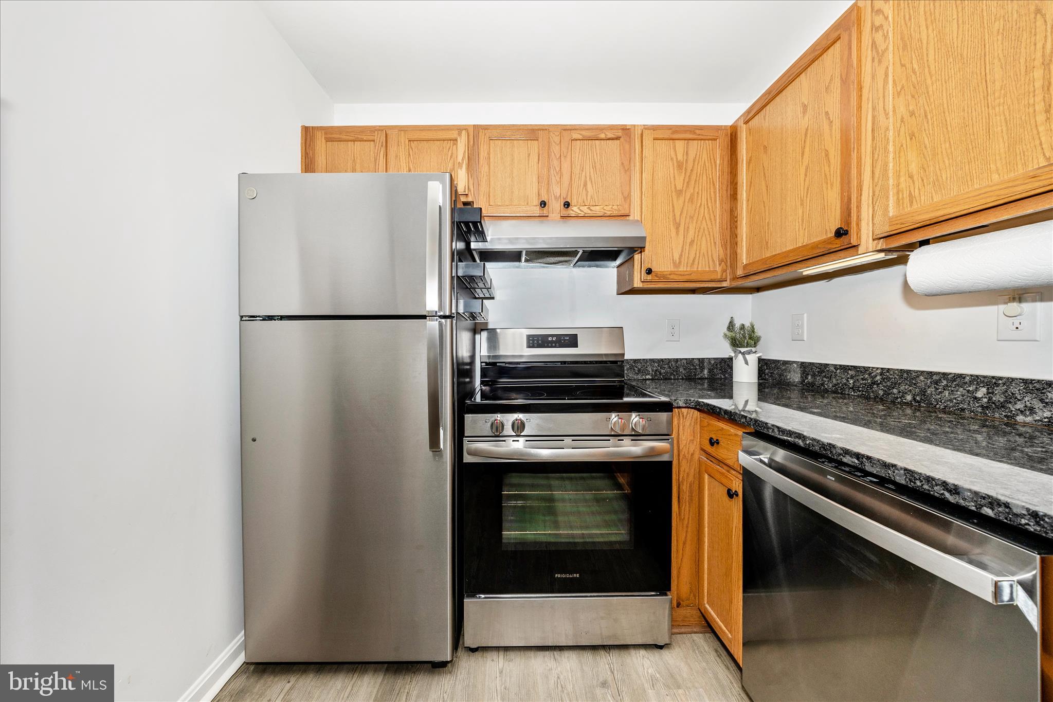 916 Harwood Road Hagerstown, MD 21740 - Photo 18 of 52 a kitchen with a stove and a refrigerator
